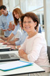 Photo: Senior woman attending business training Senior woman attending business training