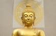 Buddha statue with wheel of life background
