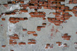 Partially plastered wall with red bricks Partially plastered wall with red bricks