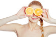 Young woman with oranges in her hands