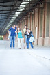 Group of friends having fun at brick building