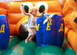 Child jumping on bouncy castle