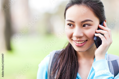 Photo: Asian student on the phone Asian student on the phone