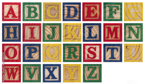 Photo: Wooden alphabet blocks isolated on white Wooden alphabet blocks isolated on white