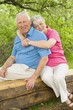 Senior Couple Sitting On Bench