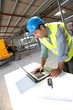 Engineer using laptop computer on construction site Engineer using laptop computer on construction site