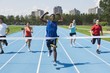 Runners On A Race Track At Finish Line