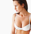 Sexy thoughtful lingerie model against white background