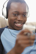 Black boy enjoying music on headphones