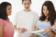 Intelligent students discussing notes together on white