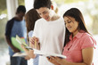 Students discussing their notes before the exam