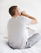 Young guy yawning in morning - Rear view