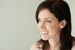 Foto: Closeup of a female looking at copyspace with a smile Closeup of a female looking at copyspace with a smile