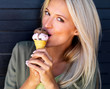 Pretty young girl having an ice cream