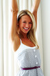 Happy young woman rejoicing success