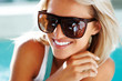 Happy young lady with sun glasses