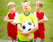 Football players looking at rival player as he is wearing a mask
