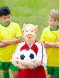 Soccer players looking at rival player as he is wearing mask