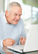 Fatigue mature man with laptop trying to keep awake