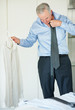 Mature business man getting ready for office