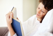 Foto: Happy middle aged woman reading book Happy middle aged woman reading book
