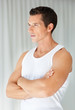 Confident young man with folded hands