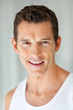 Closeup of a happy young Caucasian man smiling