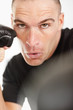Middle aged boxer wearing boxing gloves in a fighting position