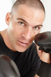Middle aged man wearing boxing gloves