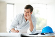 Handsome young male civil engineer thinking