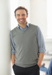 Smart middle aged man with his hands in pockets