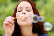 Foto: Pretty young girl making soap bubbles Pretty young girl making soap bubbles