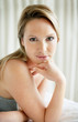 Pretty young woman lying on the bed