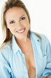 Smiling woman wearing only a blue shirt