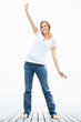 Achievement - Happy female standing on a porch