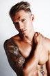 Photo : Barechested man with hand on shoulder Barechested man with hand on shoulder
