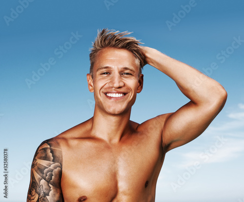 Photo: Young man smiling Young man smiling