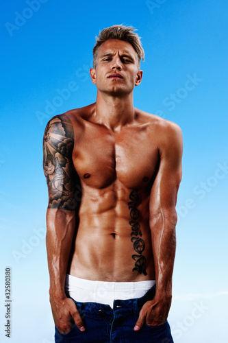 Photo: Young guy with a muscular body Young guy with a muscular body