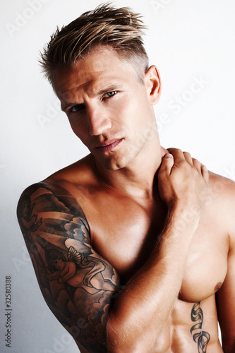 Photo: Barechested man with hand on shoulder Barechested man with hand on shoulder