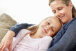 An adorable daughter resting on caring mother