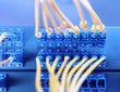 Photo: shot of network cables and servers in a technology data center . shot of network cables and servers in a technology data center .