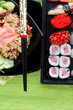 Sushi with chopsticks shot on green Sushi with chopsticks shot on green