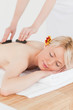 Pretty woman receiving a massage with hot stones Pretty woman receiving a massage with hot stones