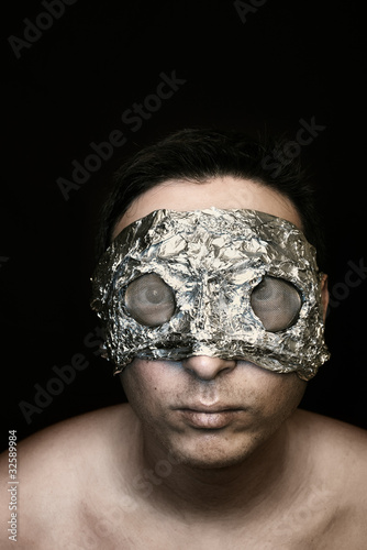 Photo: Freak in foil mask and reticulated facet eye covers on black Freak in foil mask and reticulated facet eye covers on black