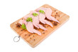 Raw chicken wings with condiments on wooden board