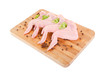 Raw chicken wings on chopping board