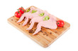 Raw chicken wings with condiments on chopping board