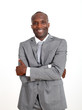 Photo: Smiling businessman with arms crossed on white backgound Smiling businessman with arms crossed on white backgound