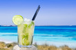 Cocktail mojito ice lemon straws in tropical beach Cocktail mojito ice lemon straws in tropical beach