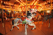 Foto: Beautifully decorated carousal horses on a merry-go-round Beautifully decorated carousal horses on a merry-go-round